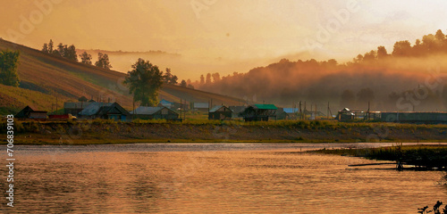 beautiful Ural river Belaya in the morning fog at dawn in summer