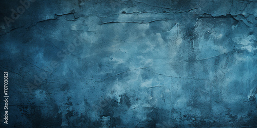 old blue concrete grungy plaster wall Abstract blue grungy wall with various shades of blue, light and dark patches and some flaking paint, empty background or backdrop graphic material.