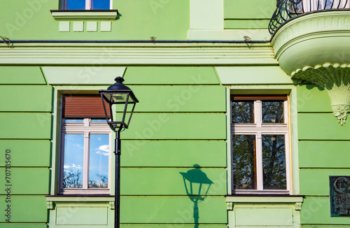 Detail of Mika Alas's house at Kosancicev Venac street, street lamp and the green facade