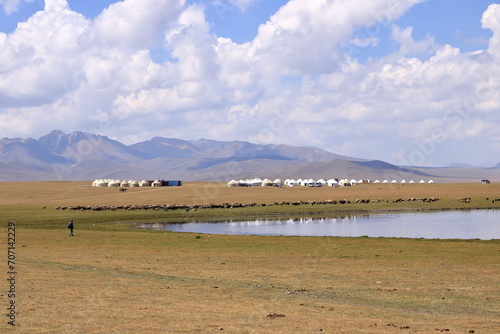 Vast Kyrgyz steppe, near Song kol lake. Mountains in far background. Kyrgyzstan