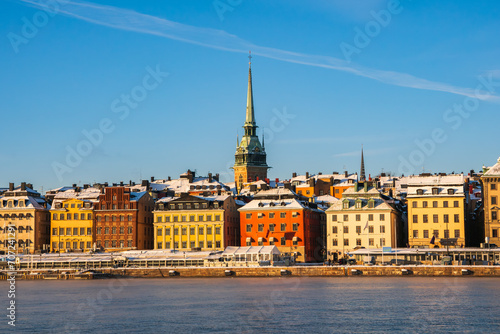 A cold sunny winter morning in Stockholm, with the historic buildings of the old town (gamla stan) near the waterfront. German church spire