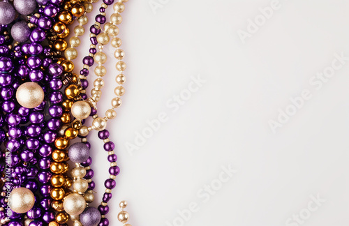 Mardi Gras beads on a white background, uniformly staged, purple and beige