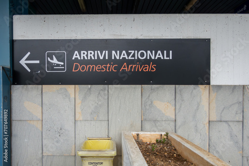 Palermo, Sicily, Italy A sign in Italian and English at the Palermo airport, or Falcone-Borsellino, says Domestic Arrivals.