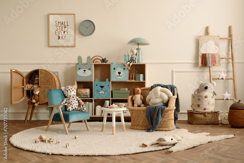Warm and cozy kids room interior with mock up poster frame, beige wall with stucco, colorful sideboard, braided armchair, plush toys, brown pillow and personal accessories. Home decor. Template.