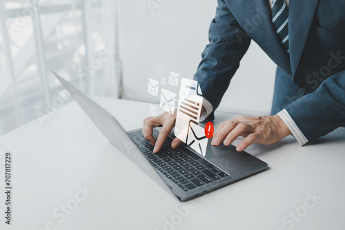 Concepts of using email in business, sending and replying to emails with customers, company email notifications and virus screening, official business communication.