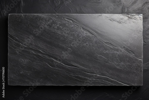 Empty black granite board on textured cement background, top view with copy space.