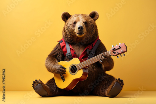 bear playing guitar while sitting on yellow background