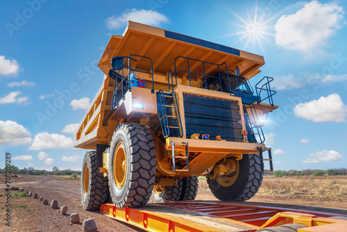 transport oversize load, loading a mining truck in a trailer to transport to a diamond mine