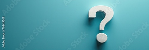 White question mark on teal background, minimalist copy space, symbolizing inquiry and curiosity