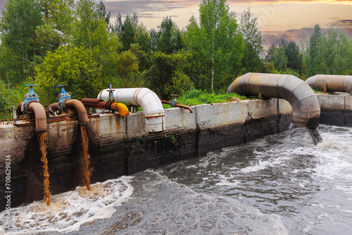 Pipes with waste water of industry is discharged into tank of treatment plant