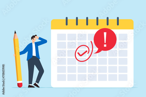 Businessman marks important day on calendar with red circle