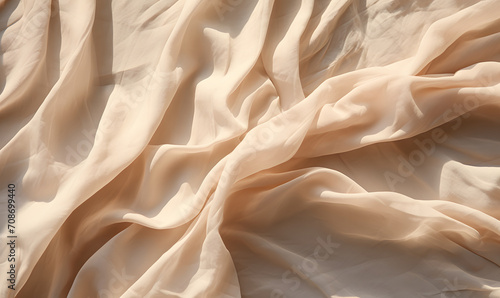Abstract neutral background, crumpled draped linen fabric texture on sun light with soft shadows, aesthetic sustainable bohemian backdrop, copy space 