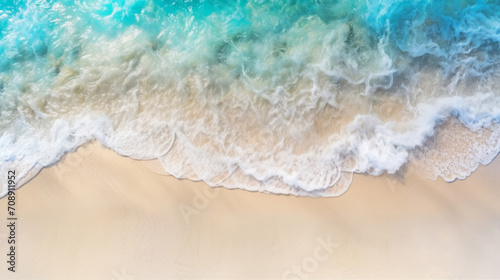 Top view on the tropical sandy seashore and waves with copy space