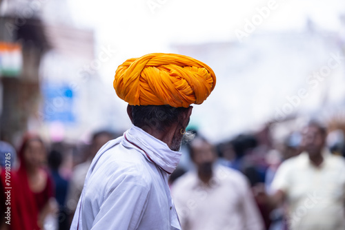 Pushkar fair, Portrait of an rajasthani old male in white traditional dress and colorful turban at pushkar fair ground. 