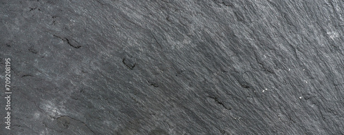 Old black slate stone texture, background or wallpaper