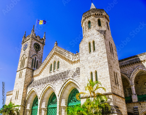 Parliament Building, Clock Tower and Flag in Bridgetown, Barbados during a beautiful summer day