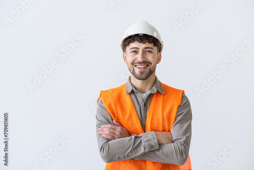Young construction workers in hard hats and hamlet on a white background