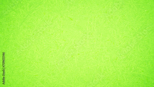 Textured background with a bright green gradient natural leaf pattern. For the backdrop, spring, rough.