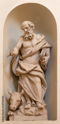 VICENZA, ITALY - NOVEMBER 6, 2023: The carved satue of St. Luke the Evanglist in the church Chiesa di San Filippo Neri by Orazio Marinali (1643 – 1720).