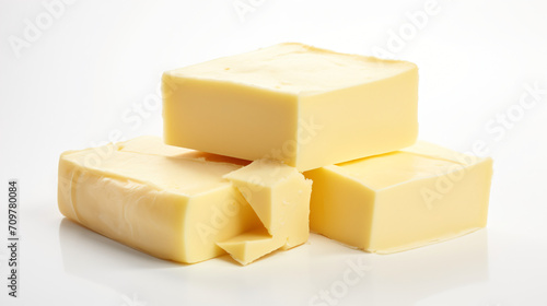 Block of fresh butter isolated on white background.