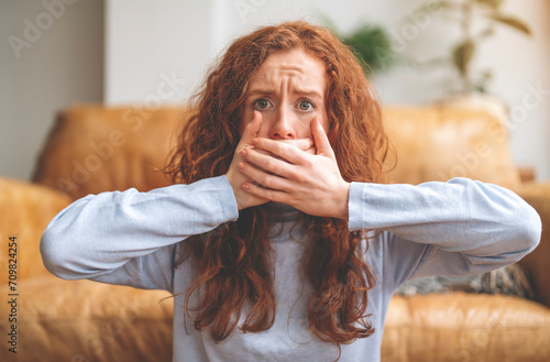 disgust smell bad breath woman shocked covering, close her mouth with hand, expression face disgusting. Negative human expression and body language concept Toned image