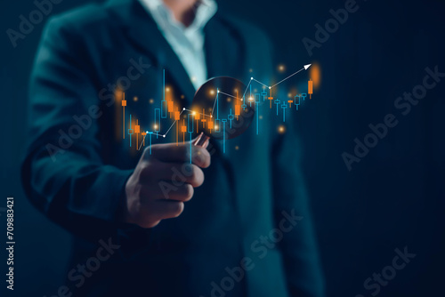 Businessman working with stock investment strategy, stock market, business growth Progress analysis data of trading that has the graph stock. invest in trading 