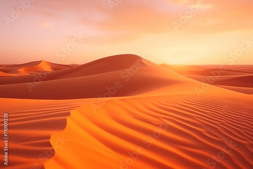 Amazing desert sunset. Beautiful Arabian desert with warm colors. Colorful contours of sand dunes at Abu Dhabi.
