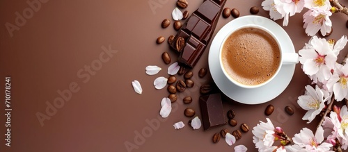 Coffee with cappuccino, milk chocolate, cherry blossoms, caffeine boosts brain, stimulates nerves, health effects, empty area, banner.