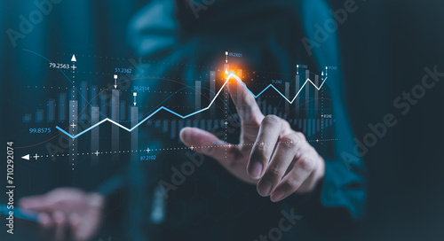 Businessman holding growth business graph progress ,startup business finance technology and investment trading trader investor.Stock Market Investments Funds and Digital Assets, graph financial data.