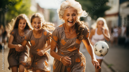 old woman running in happy mood front of kids and teen