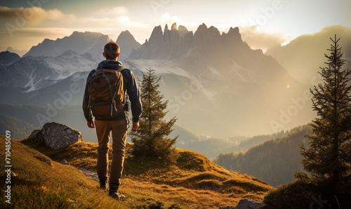 Male hiker traveling, walking alone Italian Dolomites under sunset