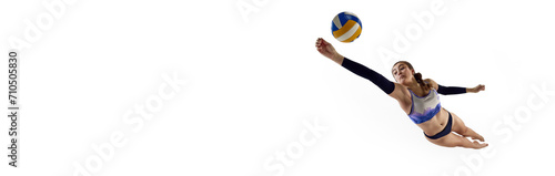 Concentrated and competitive young woman, beach volleyball player hitting ball in monition over white background. Concept of professional sport, competition, match. Banner. Empty space to insert text