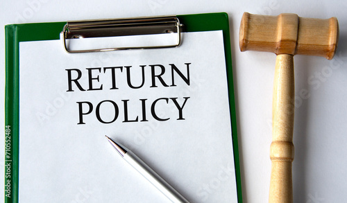 RETURN POLICY - words on a white sheet on a white background and a judge's gavel