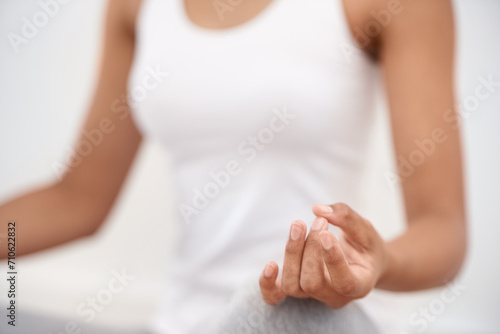 Woman, hands and meditation for yoga, zen or exercise in spiritual wellness or inner peace at home. Closeup of calm female person or yogi meditating in relax for awareness or mental health at house