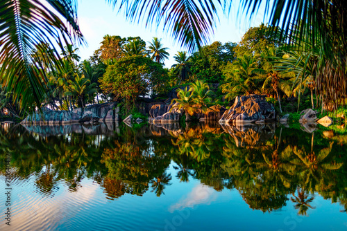 picturesque bright nature in Seychelles, lake and granite stones