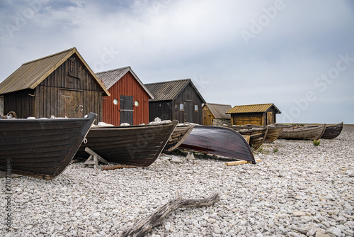 Old fishing station with wooden huts and old boats, Gotland, Sweden
