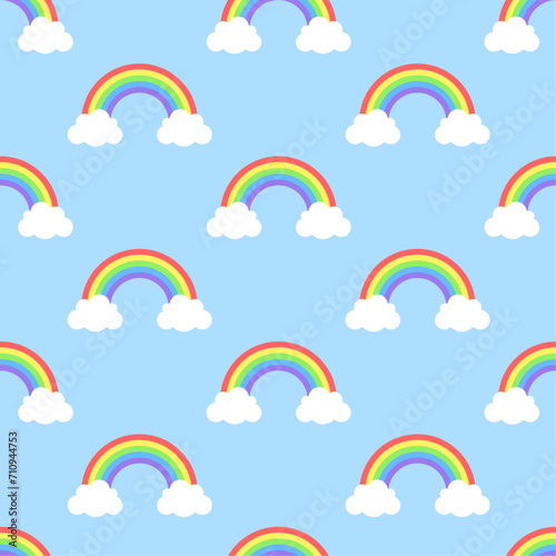 Rainbows and clouds on sky blue background. Vector seamless pattern with cute cartoon elements. Best for textile, wallpapers and nursery decoration.