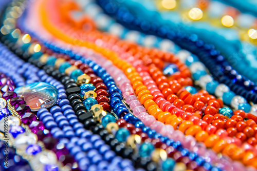 close-up of a beaded earring, with different colored beads arranged in a pattern