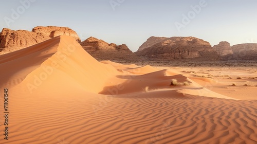 Beautiful desert landscape with large sand dunes in the foreground and mountains in the background