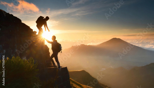 A man climbs a rocky mountain and is helped by his friend