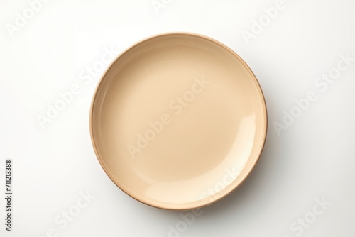 Empty beige plate on white background.