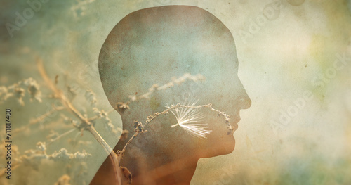 Silhouette of a human head and fluff on a branch as a symbol. Psychiatry, psychology, concept background. Overlay effect on old paper texture.