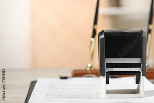 Notary contract. Stamp and document on table, closeup. Space for text