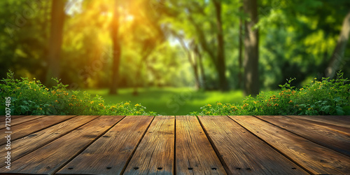 Wood floor with blurred trees of nature park background and summer season, product display montage.