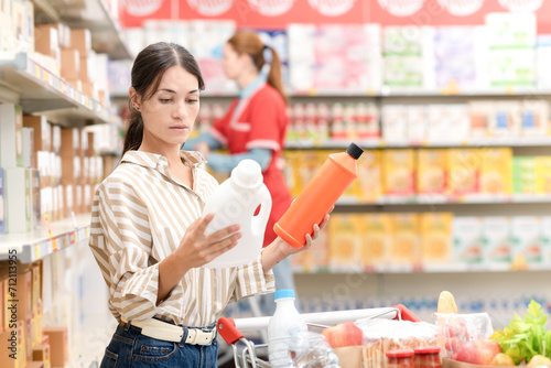 Customer comparing products at the grocery store