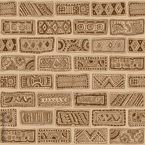 Vector seamless doodle pattern. Hand drawn dark brown bricks with geometrical ornaments on a beige background