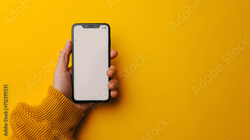 Hand holding the black smartphone with blank screen and yellow background, generative ai