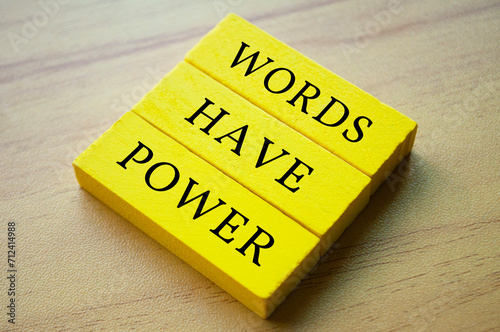 Top view of yellow wooden blocks with text Words Have Power. Motivational and inspirational concept