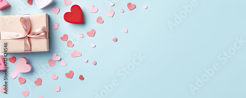 Valentines Day background. Gifts, candle, confetti, envelope on pastel blue background. Valentines day concept. Flat lay, top view, copy space