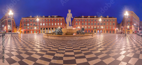 Panorama of square Place Massena with Fountain du Soleil at night in Nice, French Riviera, France